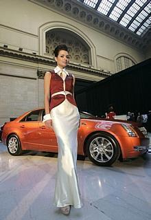 Oxana Voinarevitch models a dress inspired by the 2008 Cadillac CTS and designed by International Academy of Design & Technology student Amber.